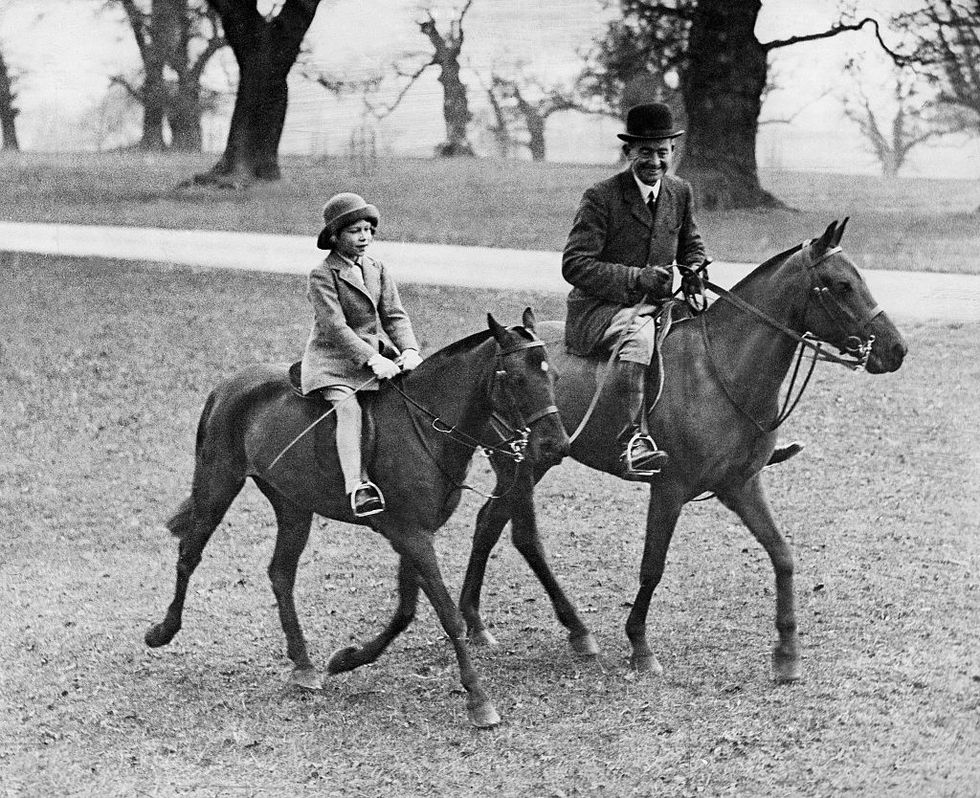 Queen Elizabeth II taking a horseback riding lesson in Windsor Park