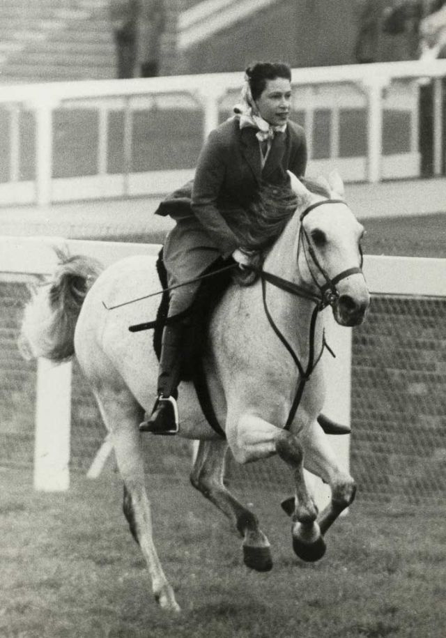 June 16, 1961 Queen Elizabeth cantering up to the start of a five-furlong outing.