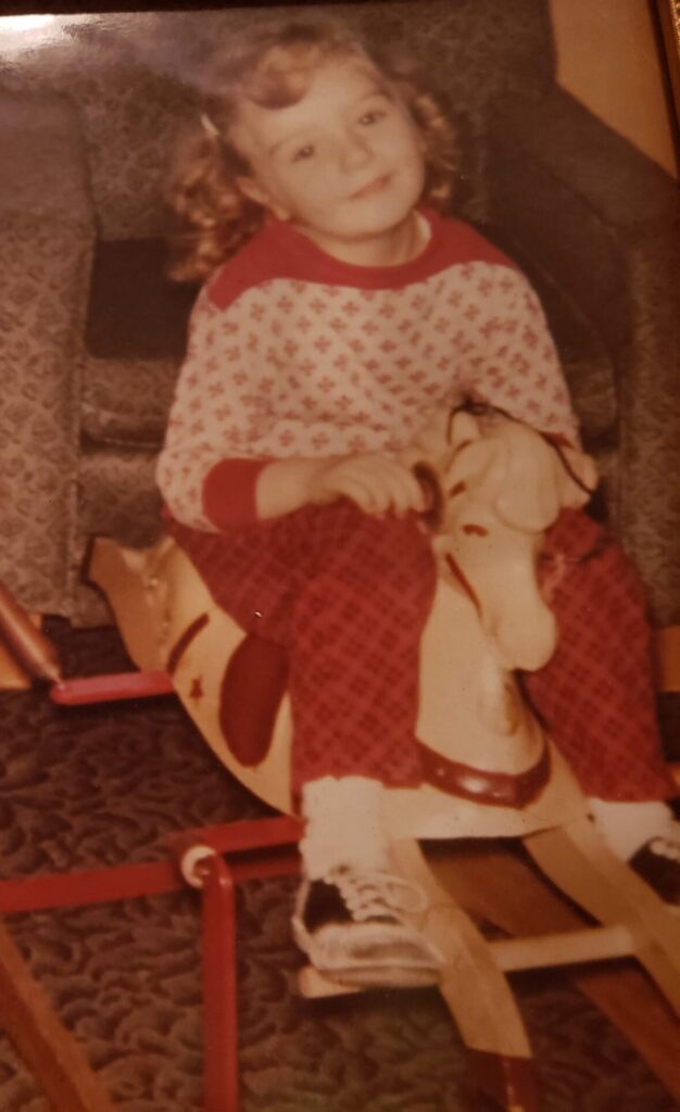 Little girl on rocking horse