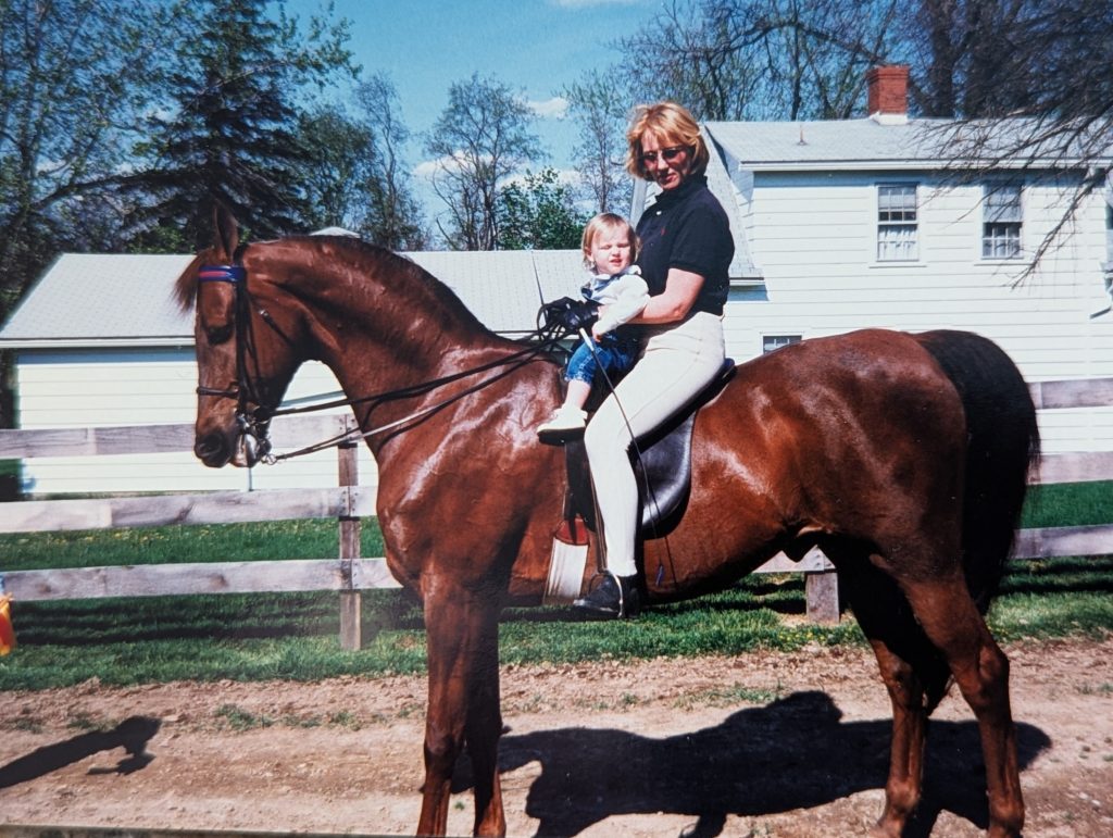 Lady and girl on horse